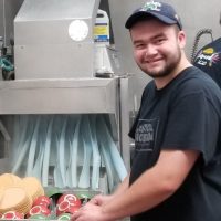 Donnie works in the community washing dishes at a local restaurant.