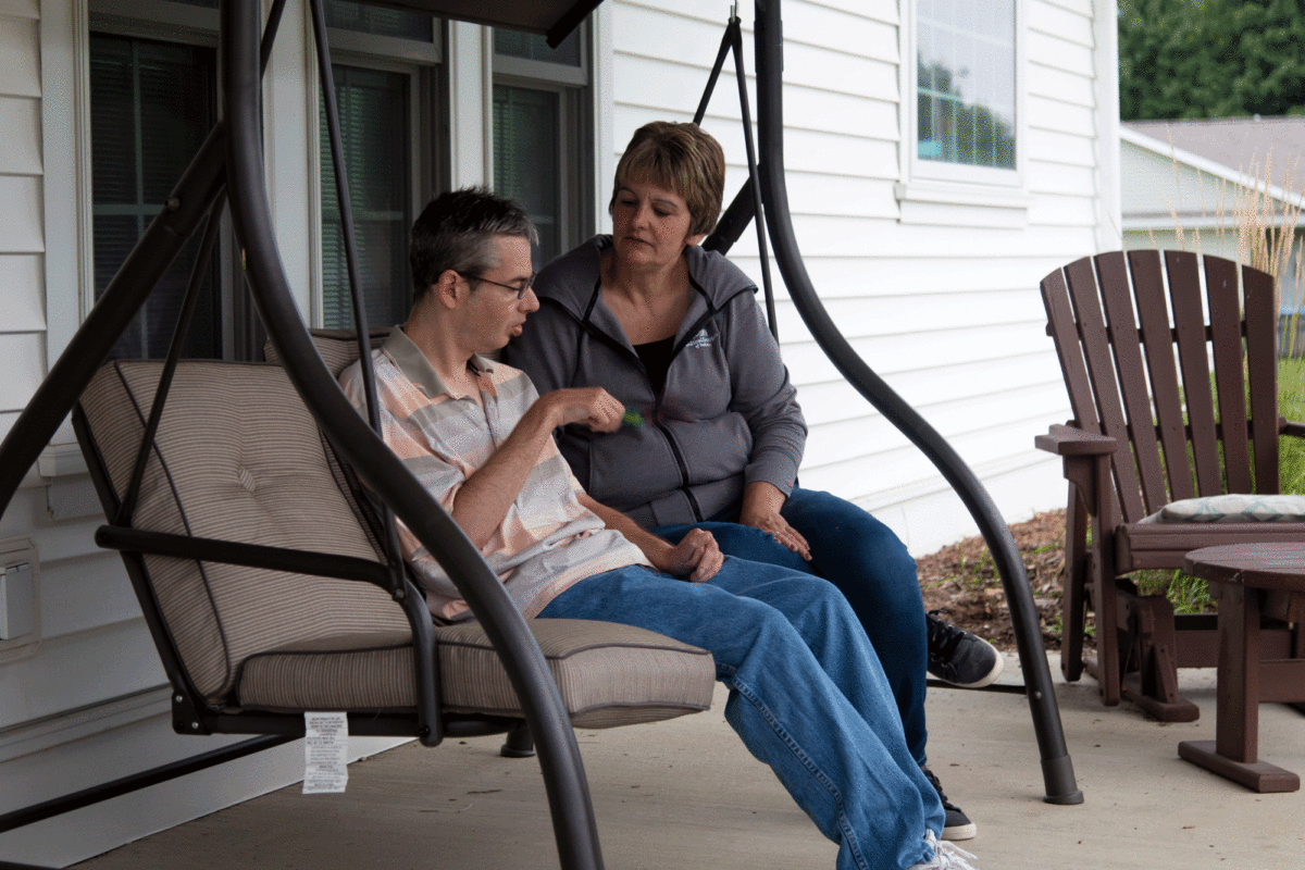 Man and woman on porch swing